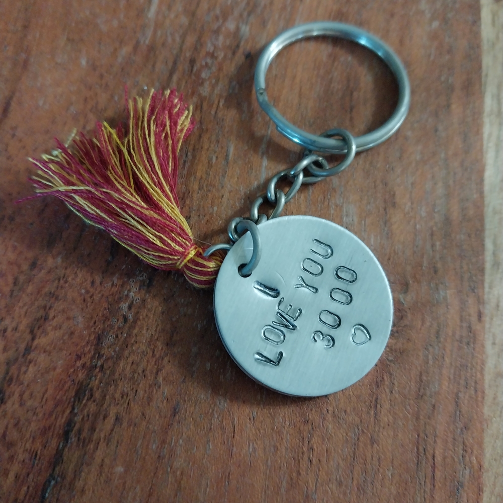 Silver Keychain with Red Tassel